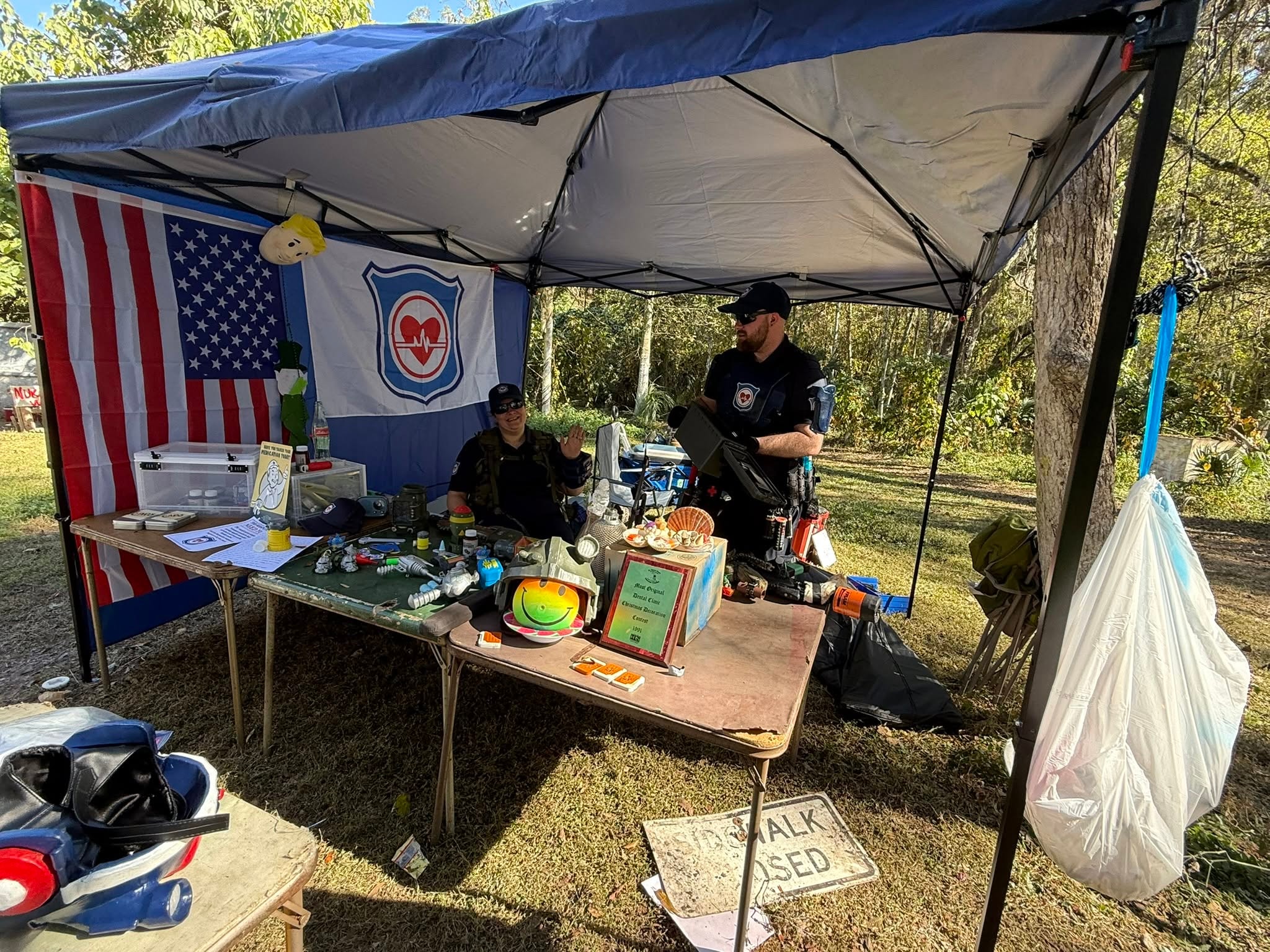 Florida Responders aid station tent with American flag and faction banner at a MindGame Productions event