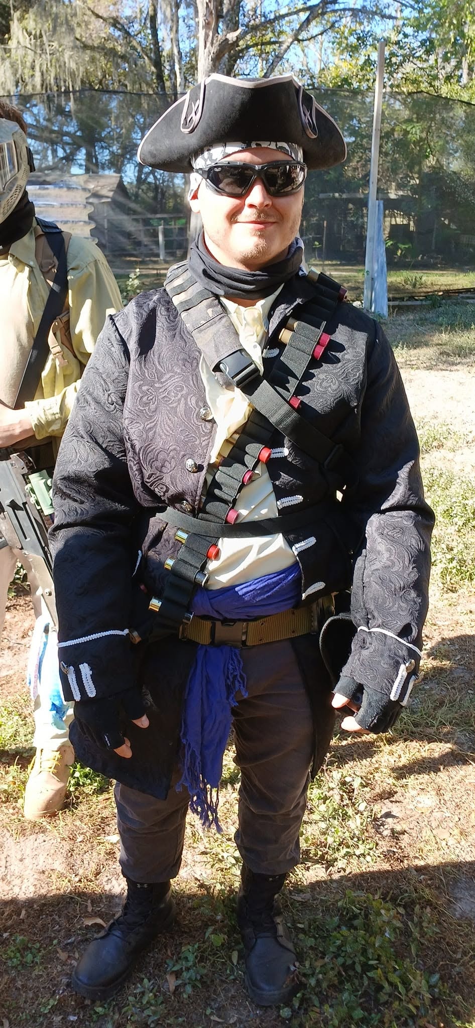 Ravager in black coat with bandolier at a MindGame Productions event