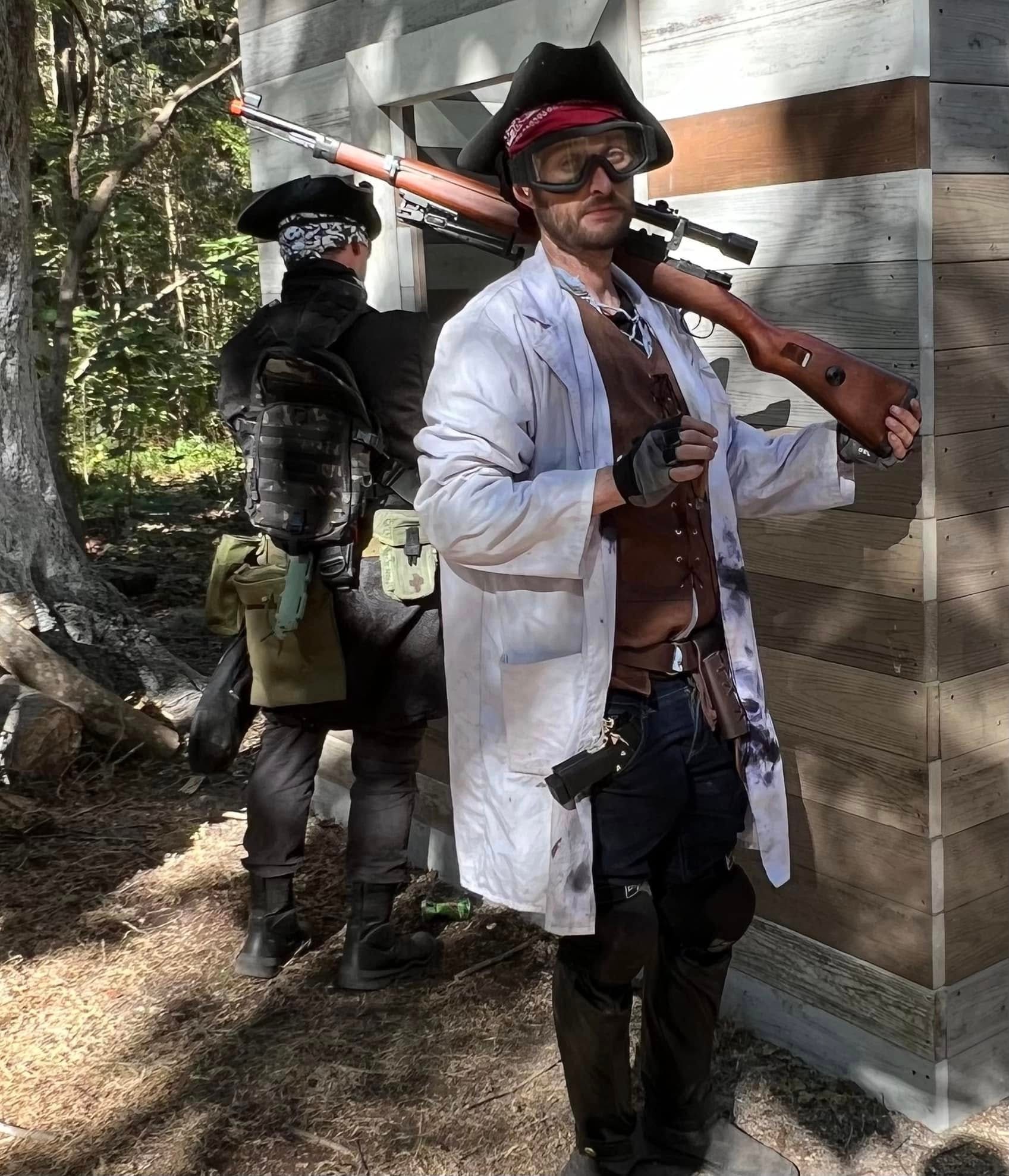 Ravager in a lab coat and tricorn hat with rifle at a MindGame Productions event