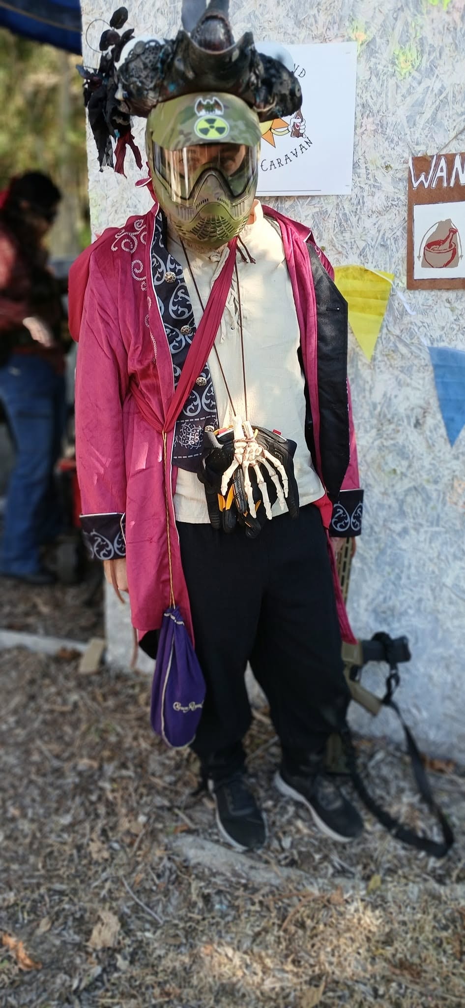 Ravager in pink coat with skeleton gloves at a MindGame Productions event