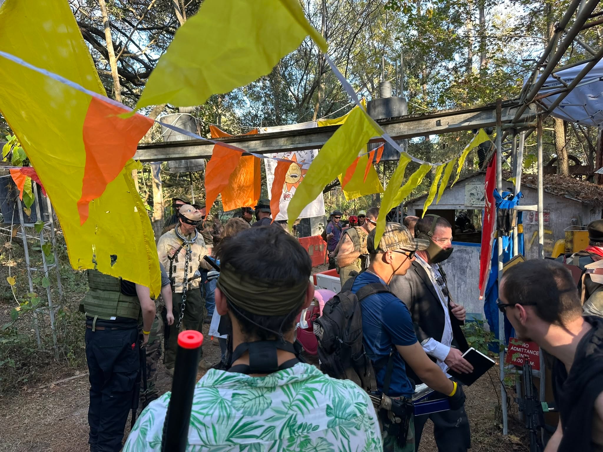 Players crowding the Sunshine Band Merchant Caravan at a MindGame Productions event
