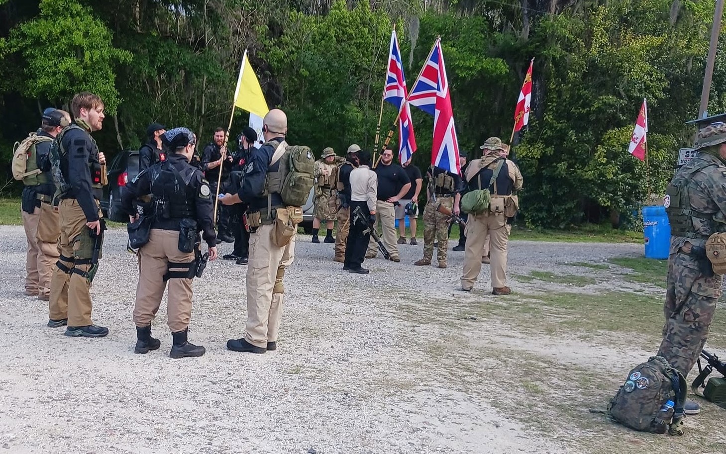 Factions assembled with flags at King and Country event