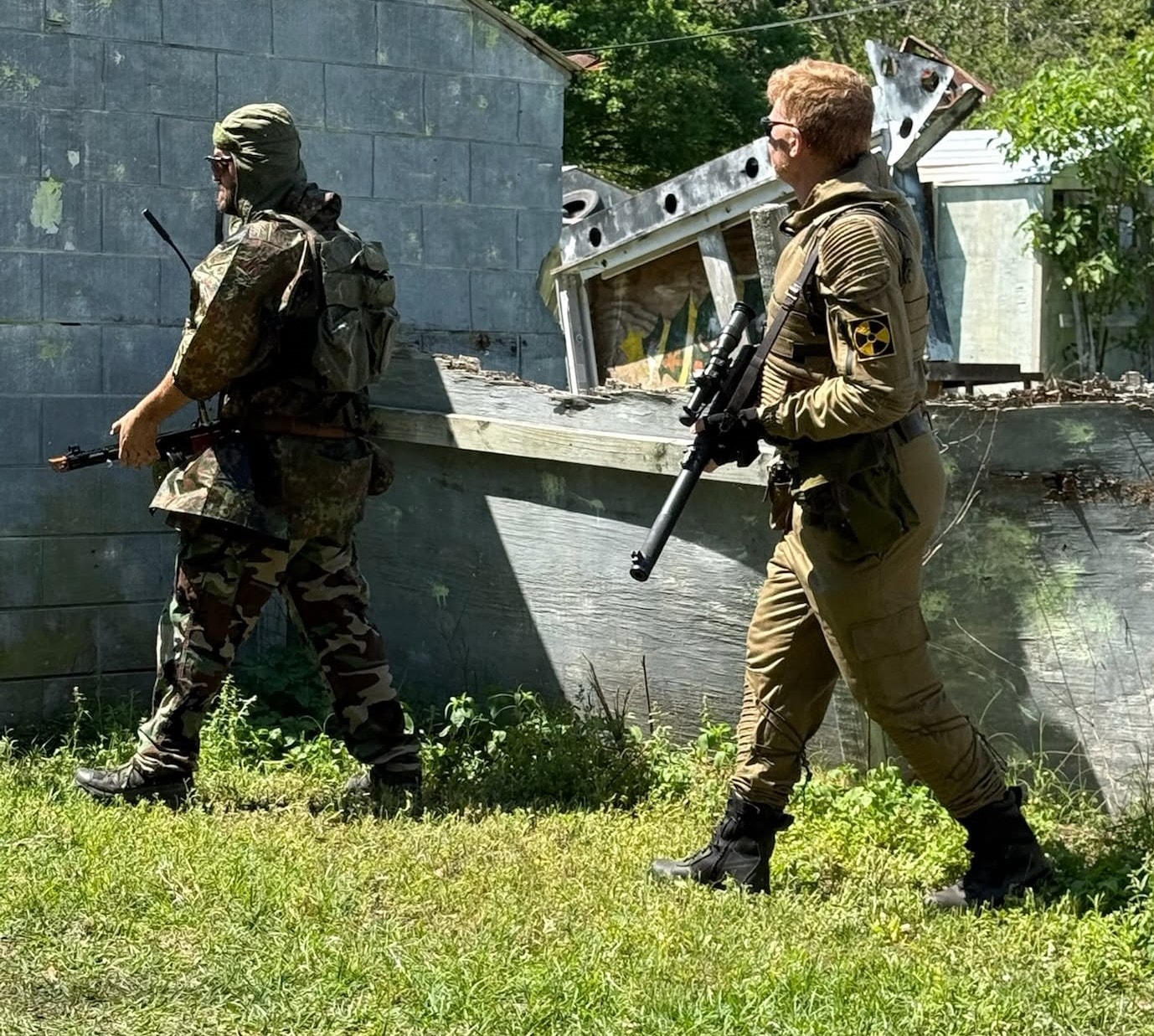 Two armed Zone players at an industrial site