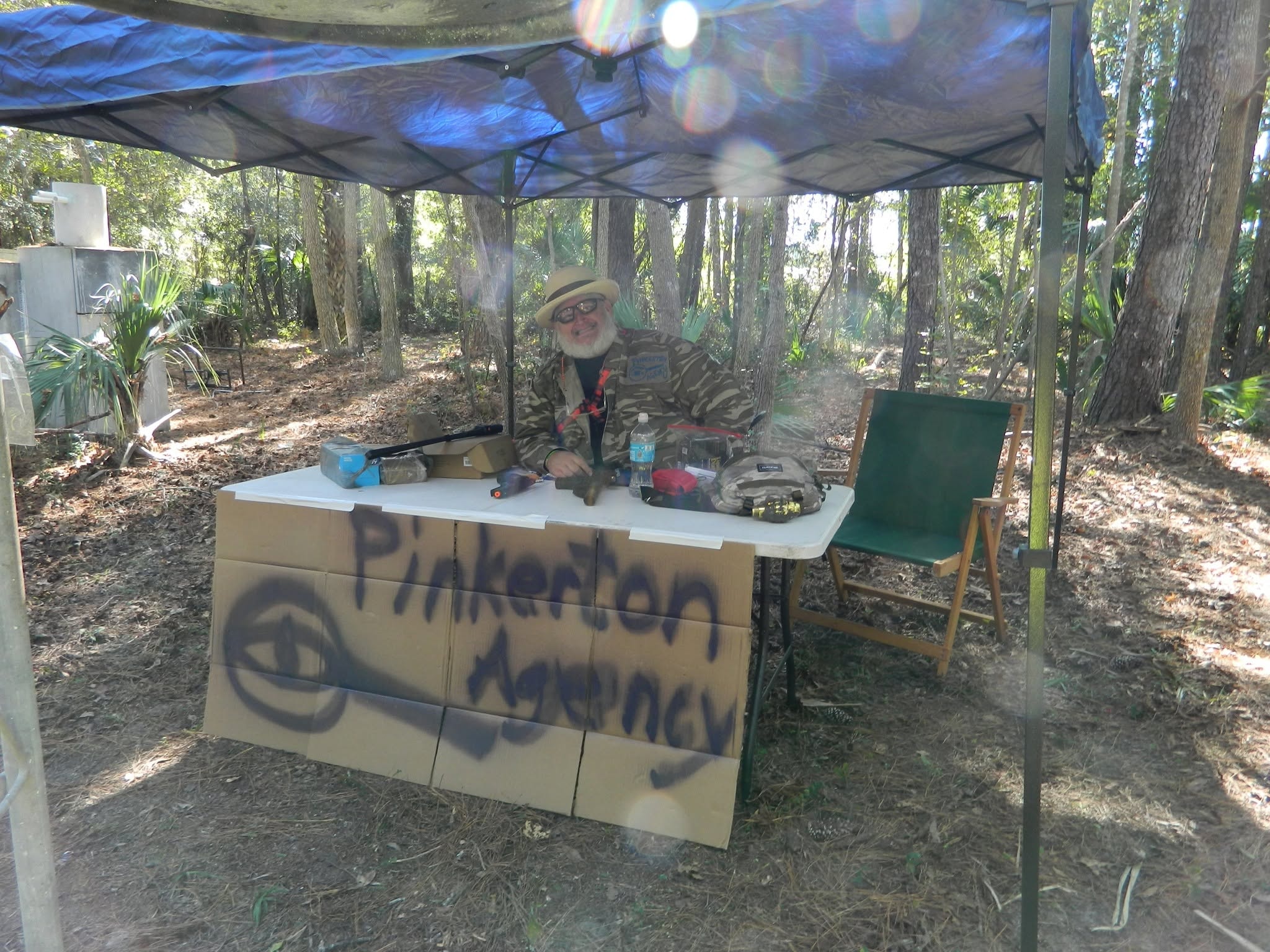 Player at outdoor vendor booth in forest