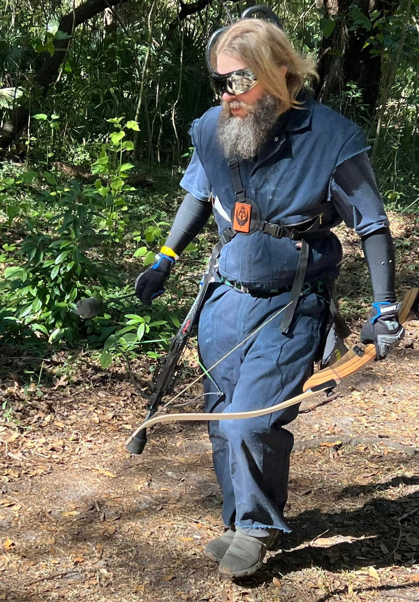 Player with bow and arrow in forest