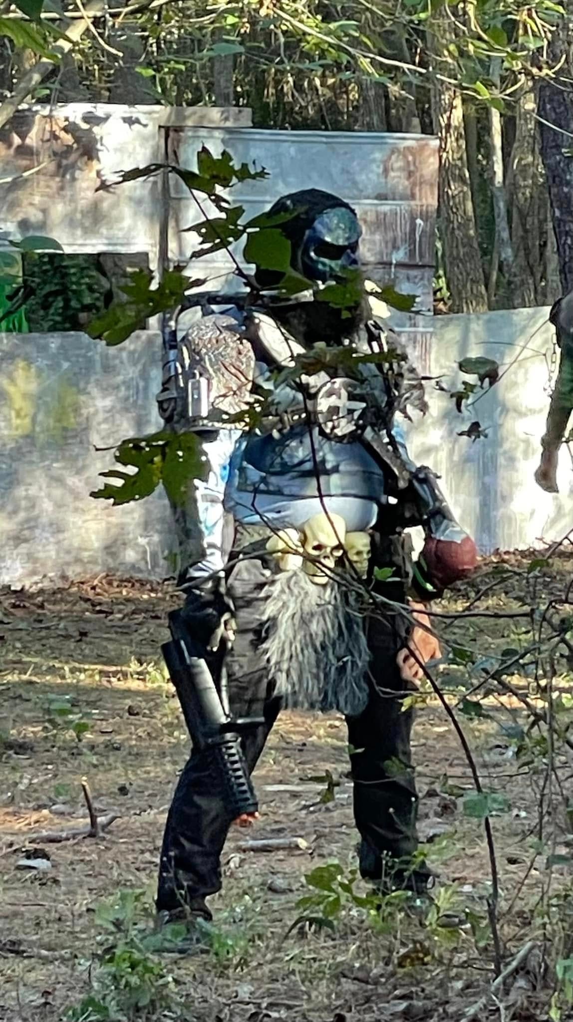 Paintball player in tactical gear outdoor