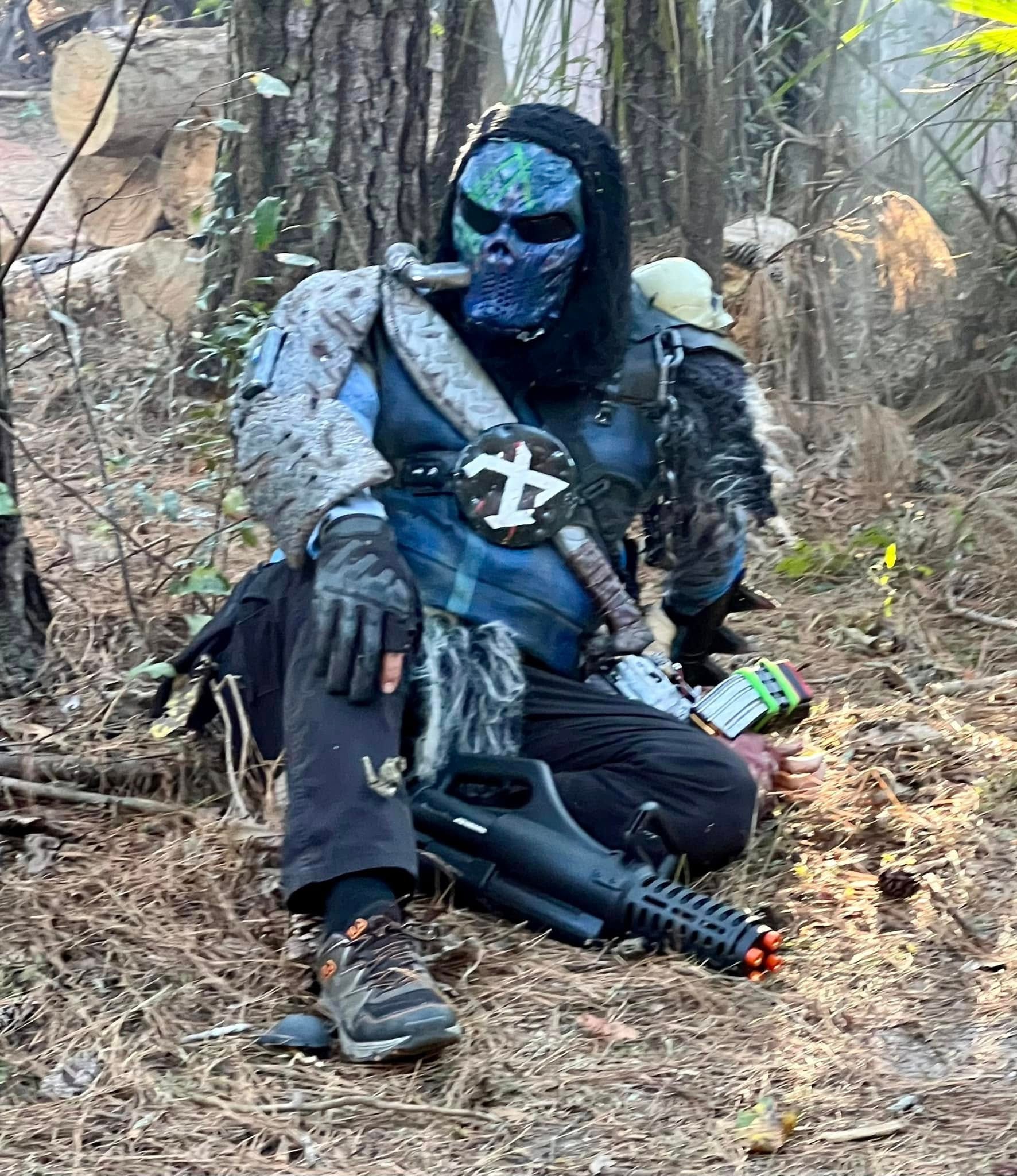 Costumed character posing in forest setting