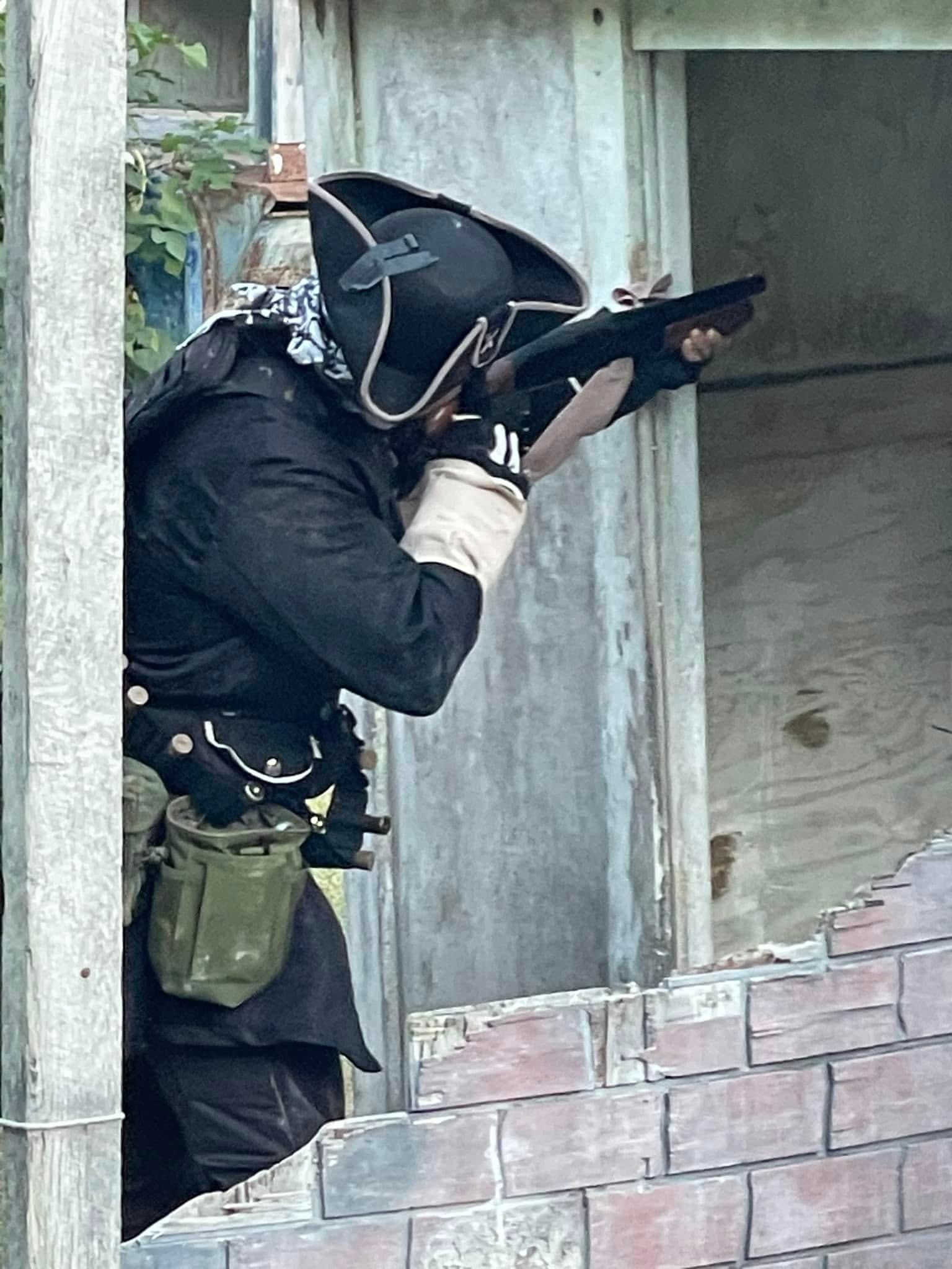 Pirate-costumed player aiming rifle