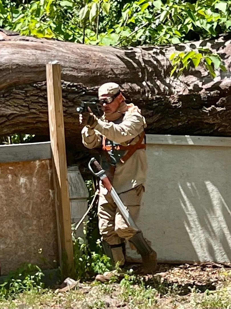 Player with chainsaw in forest