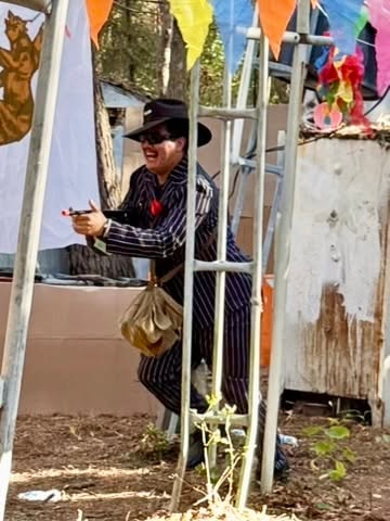 Man in cowboy hat entering carnival booth