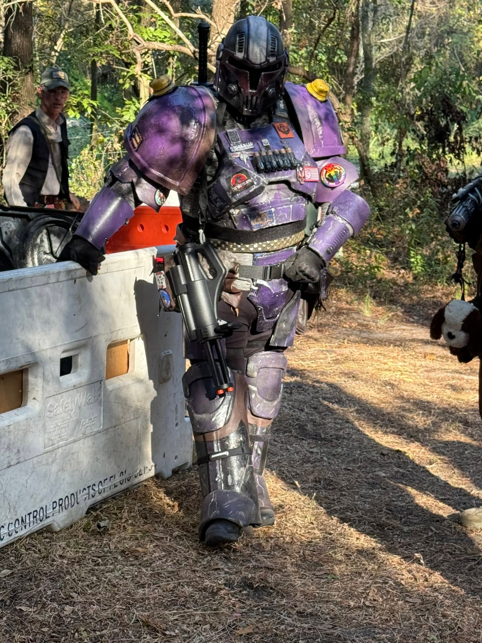 Purple armored costumed character in forest