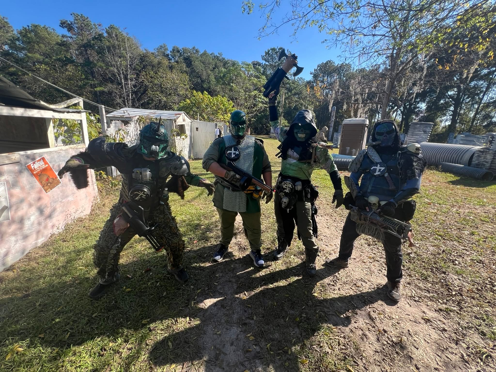 Five armored faction players posing at Wasteland event