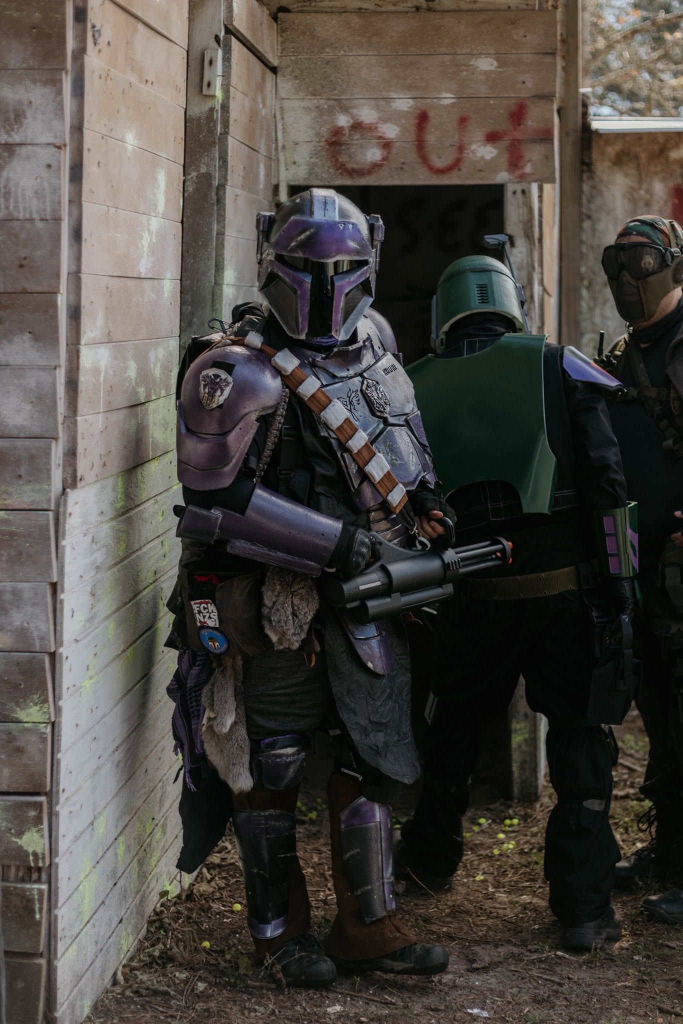 Costumed characters in sci-fi armor in alley